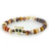 Pulsera de jaspe mookaita natural en tonos tierra y hueso tallado Santiago Rugele