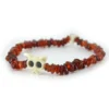Pulsera de granate natural en chips rojo vino y hueso tallado Santiago Rugeles