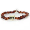 Pulsera de granate natural en chips rojo vino y hueso tallado Santiago Rugeles