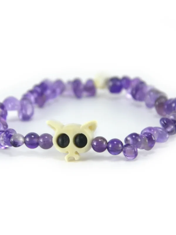 Pulsera de amatista natural morada en chips y hueso tallado Santiago Rugeles