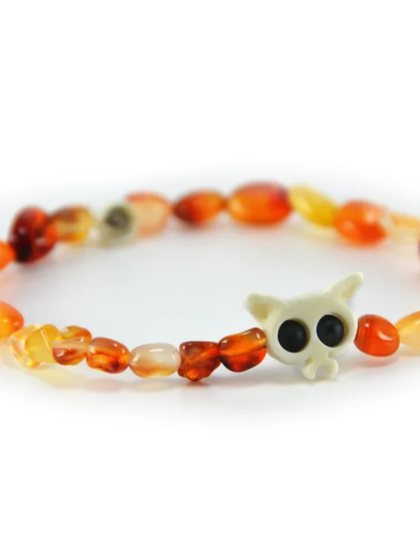 Pulsera de agata natural en tonos fuego naranja y hueso tallado Santiago Rugeles