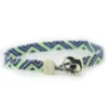 Pulsera macrame en algodon tejido verde y morado con calavera de plata 925 Santiago Rugeles